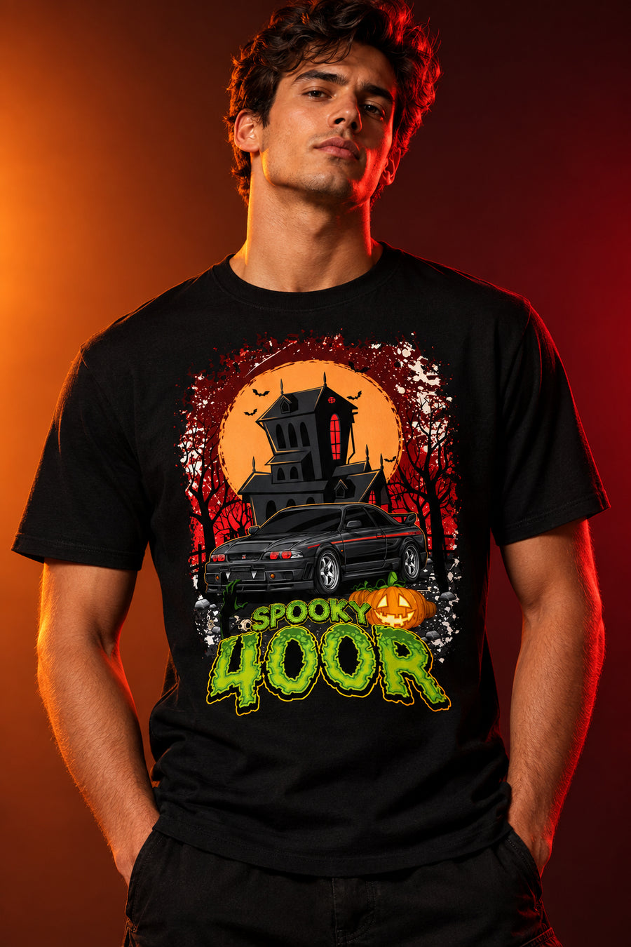 Halloween-themed graphic with a black car, haunted house, and pumpkin, featuring the text 'Spook 400R'.